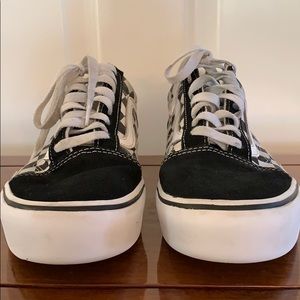 Women’s black and white platform vans.
